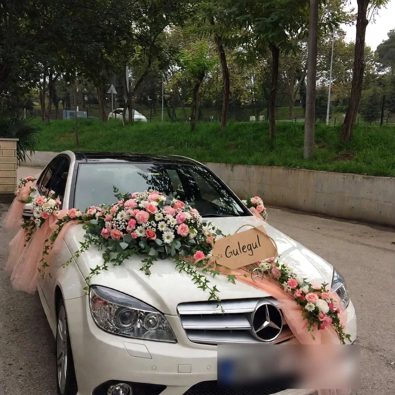 Pink Rose and Tulle Car Decor: Pink roses, white daisies and green leaves on a white car bonnet with pink tulle along the sides, GuleGul Flowers Lahore