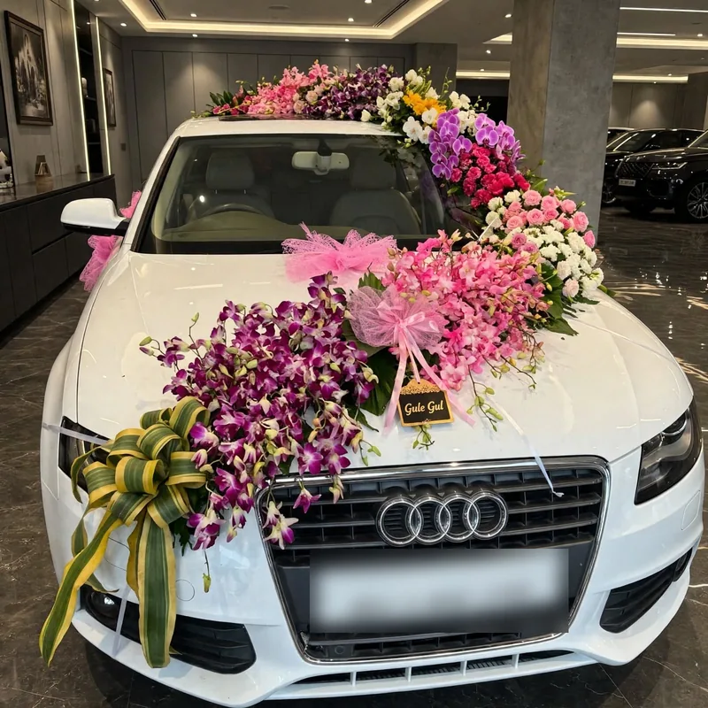 Purple Orchid Car Decor: Purple orchids and pink flowers on the bonnet and roof of a white car, with pink tulle and a ribbon bow, GuleGul Flowers Lahore