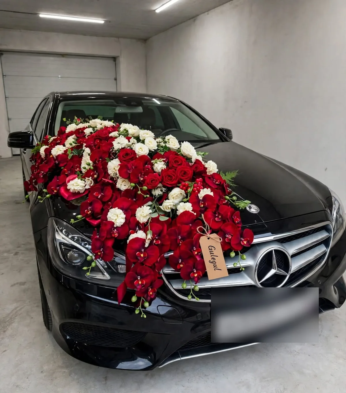 Red Orchid and Rose Car Decor: Red roses, white flowers and red orchids spread across a car bonnet, GuleGul Flowers Lahore